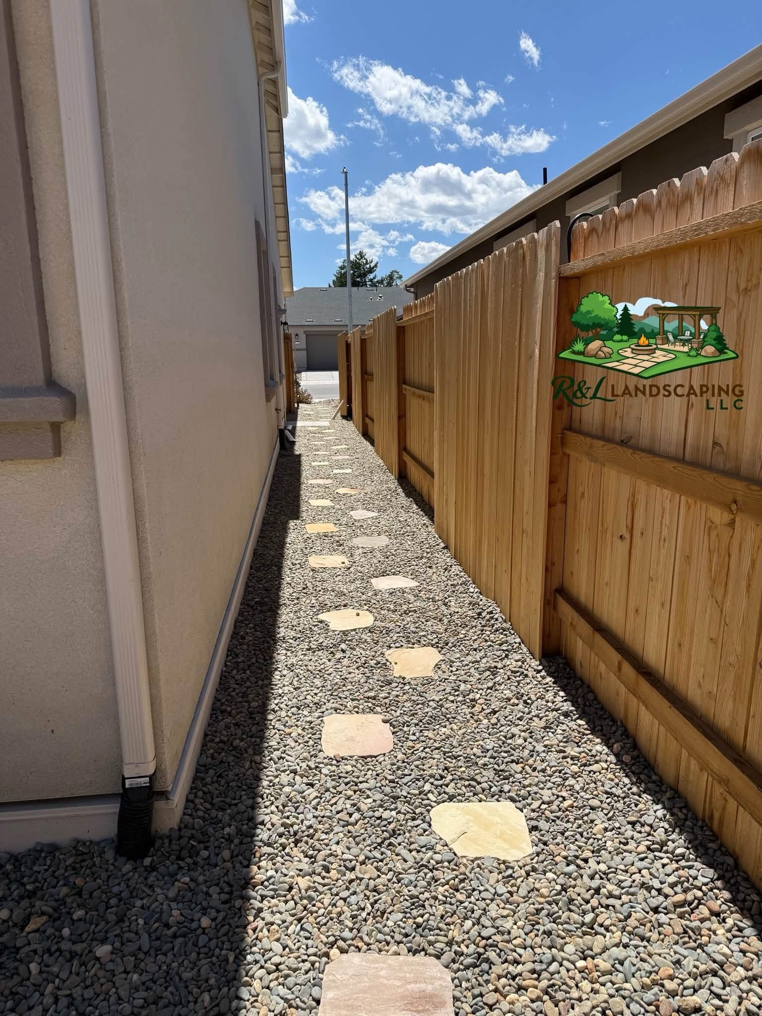 Flagstone stepping stone walkway set in decorative rock